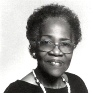 African-American woman with glasses and large necklace