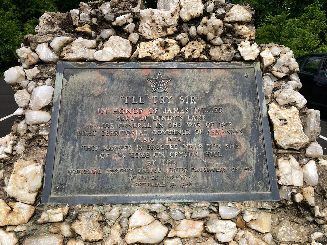 Bronze plaque set into monument composed of quartz crystal