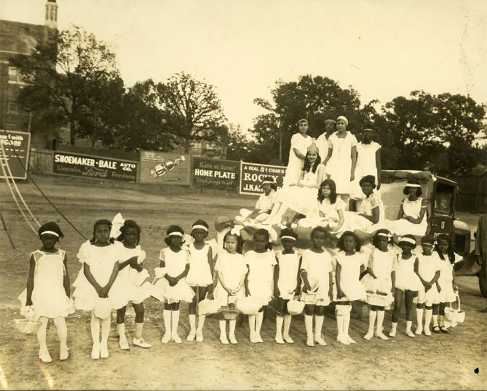 Young African American girls in white dresses