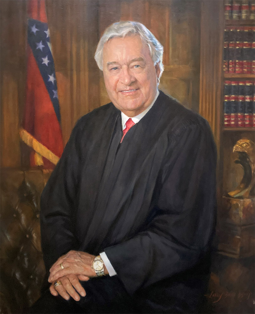 White man in tie and judge's robes