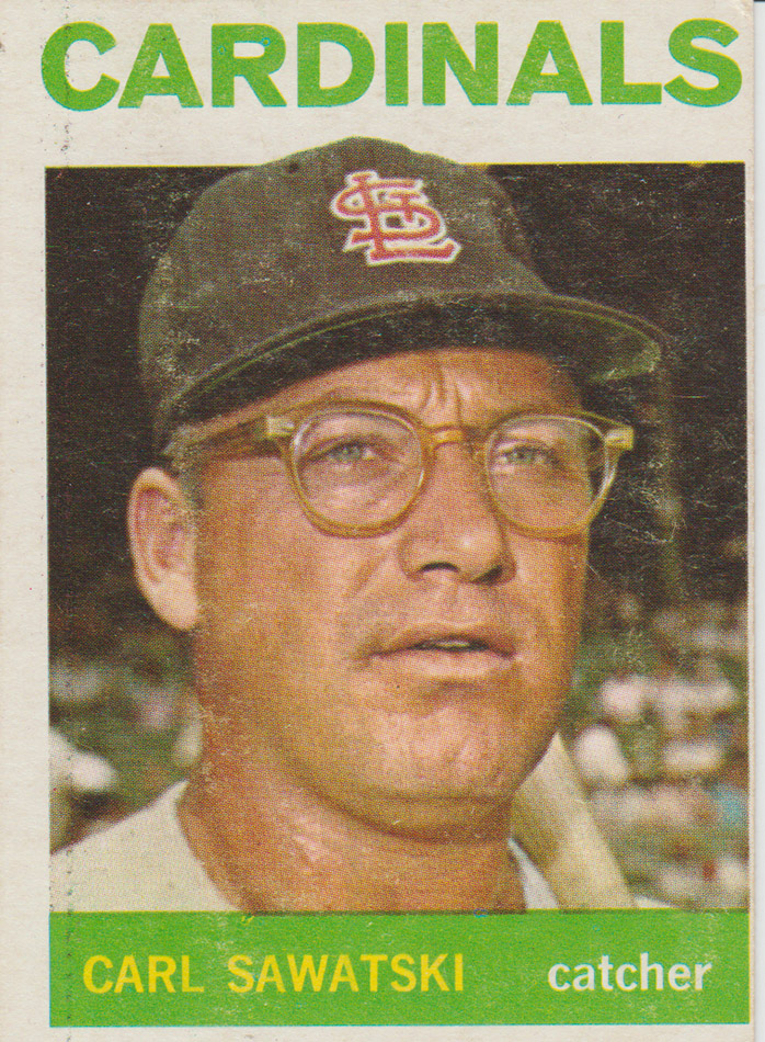 White man in baseball uniform and glasses