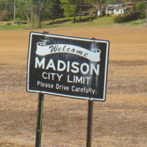 Metal sign "Welcome Madison City Limit"
