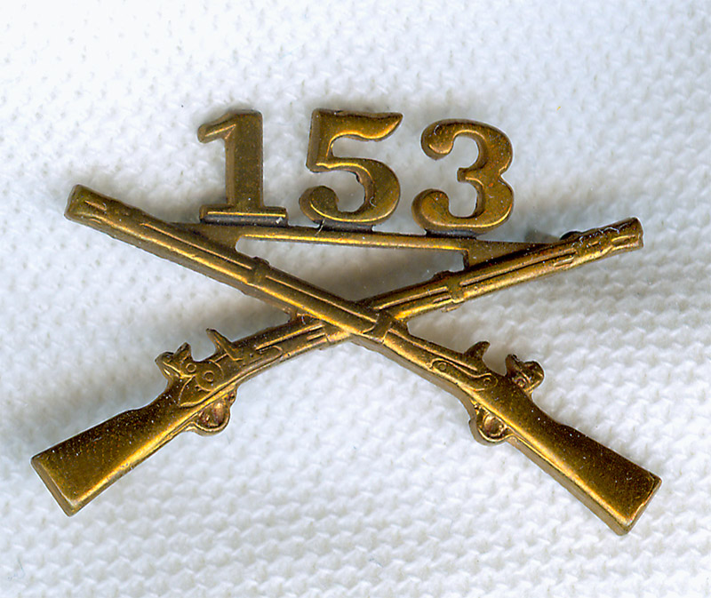 Insignia pin featuring two crossed muskets and the number "153"