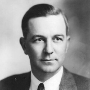 White man wearing suit and tie