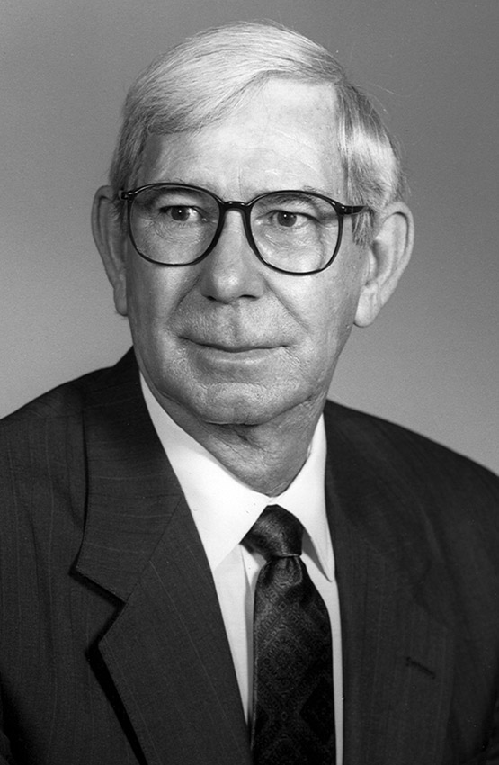 White man in suit and tie and glasses