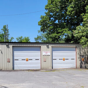 Single story metal building with two bay doors