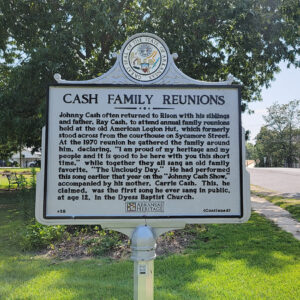 Metal historical information sign giving information about family reunions held at the old American Legion Hut