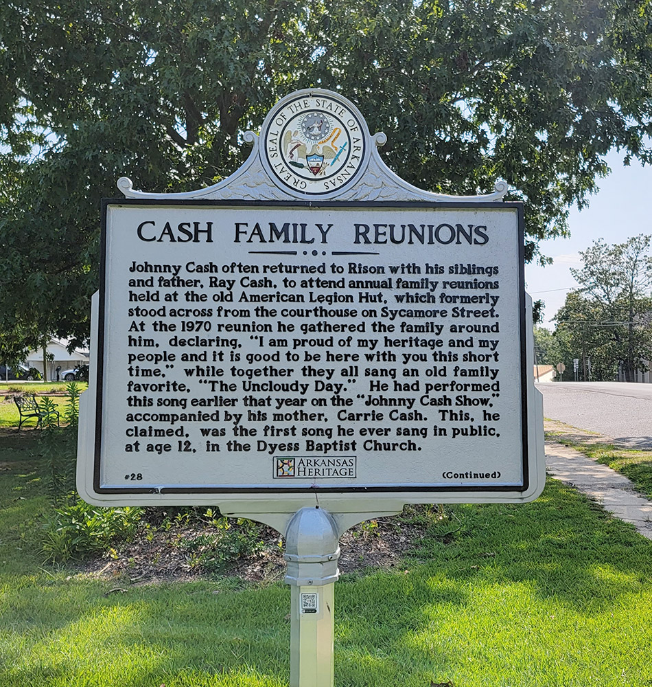 Metal historical information sign giving information about family reunions held at the old American Legion Hut