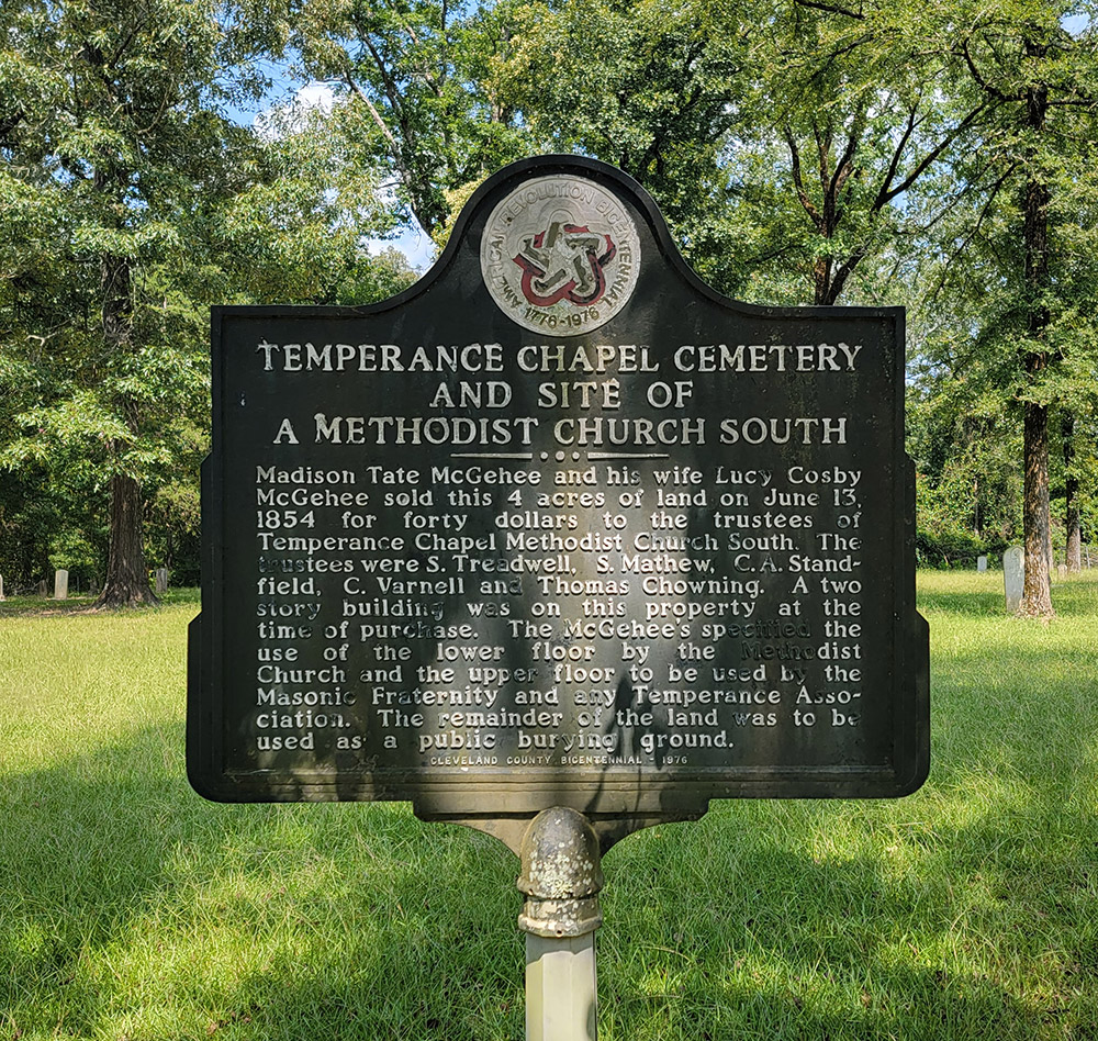 Metal sign with information about the establishment of the cemetery and a logo at the top for the American Revolution Bicentennial 1776 to 1976