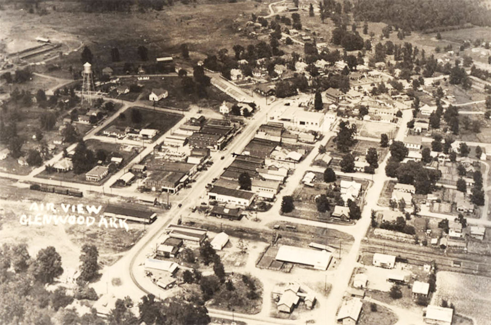 Small town with buildings and trees seen from the air