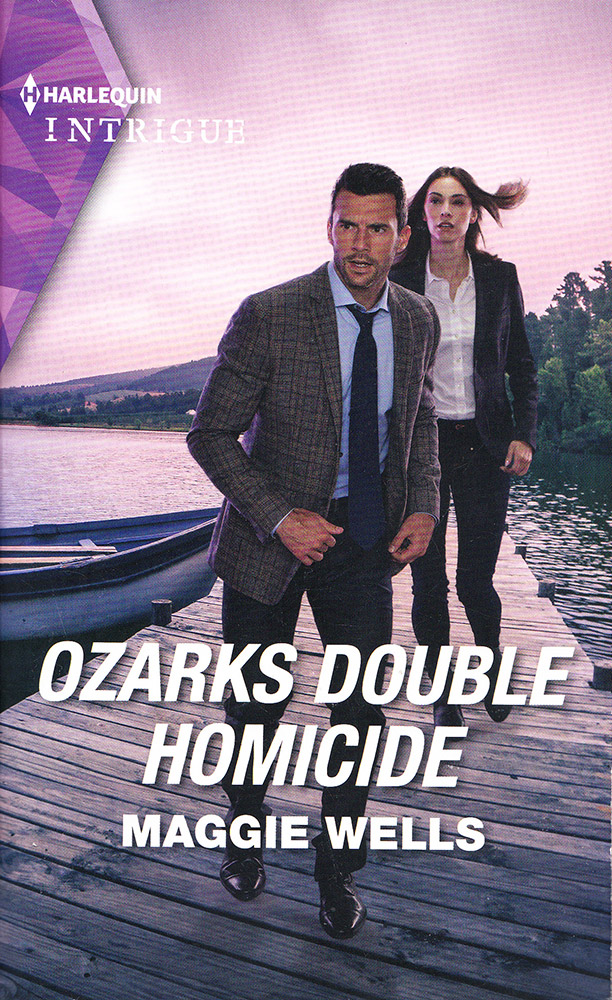 Romance and crime related book cover featuring attractive white man and woman in blazers walking on a dock