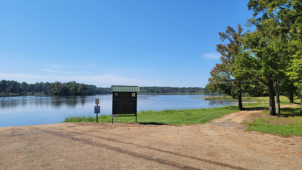 Blue lake with sign and access point
