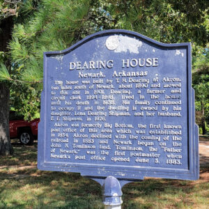 Metal sign with information about the Dearing House
