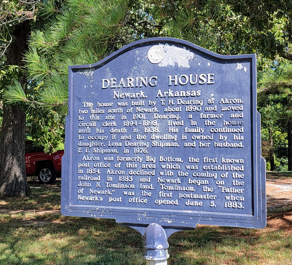 Metal sign with information about the Dearing House