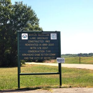 Sign with information about the construction and renovation of Marion McCollum Lake Greenlee