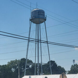 water tower atop tall legs and "Poyen Indians" on the side