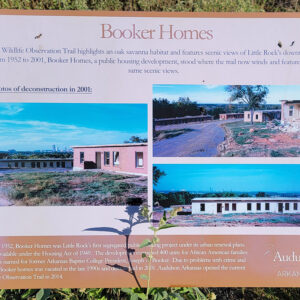 Sign featuring explanations of the history of Booker Homes and showing photos of former housing developments