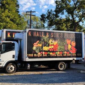 Box delivery trucks that say K. Hall and Sons on the side