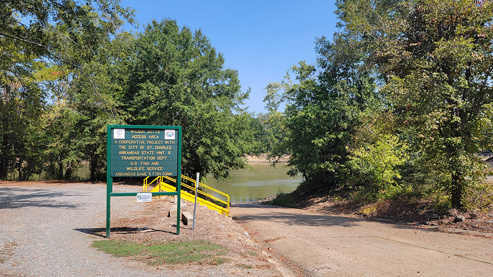 Sign pointing to river access