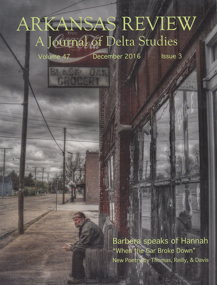 Cover of a journal with a man sitting on a bench outside a storefront grocery store with a sign saying "Black Oak Grocery"