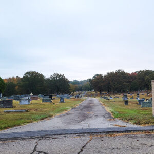Entrance to a cemetery with concrete road