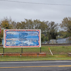 Two large signs commemorating veterans