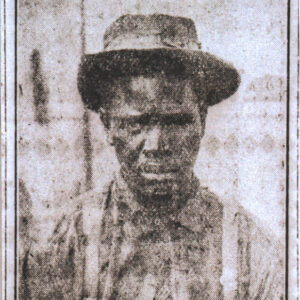 Newspaper photo of African American man wearing suspenders and hat
