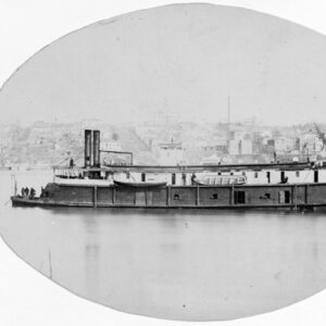 Paddlewheel boat on a river with city on shore
