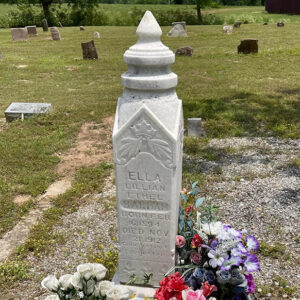 Tombstone with flowers all around it