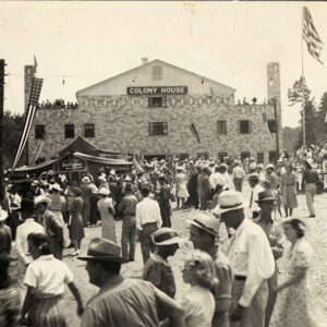 Large group of people in front of large brick building