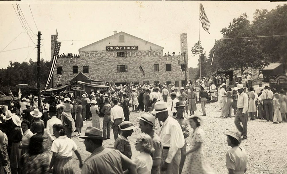 Large group of people in front of large brick building