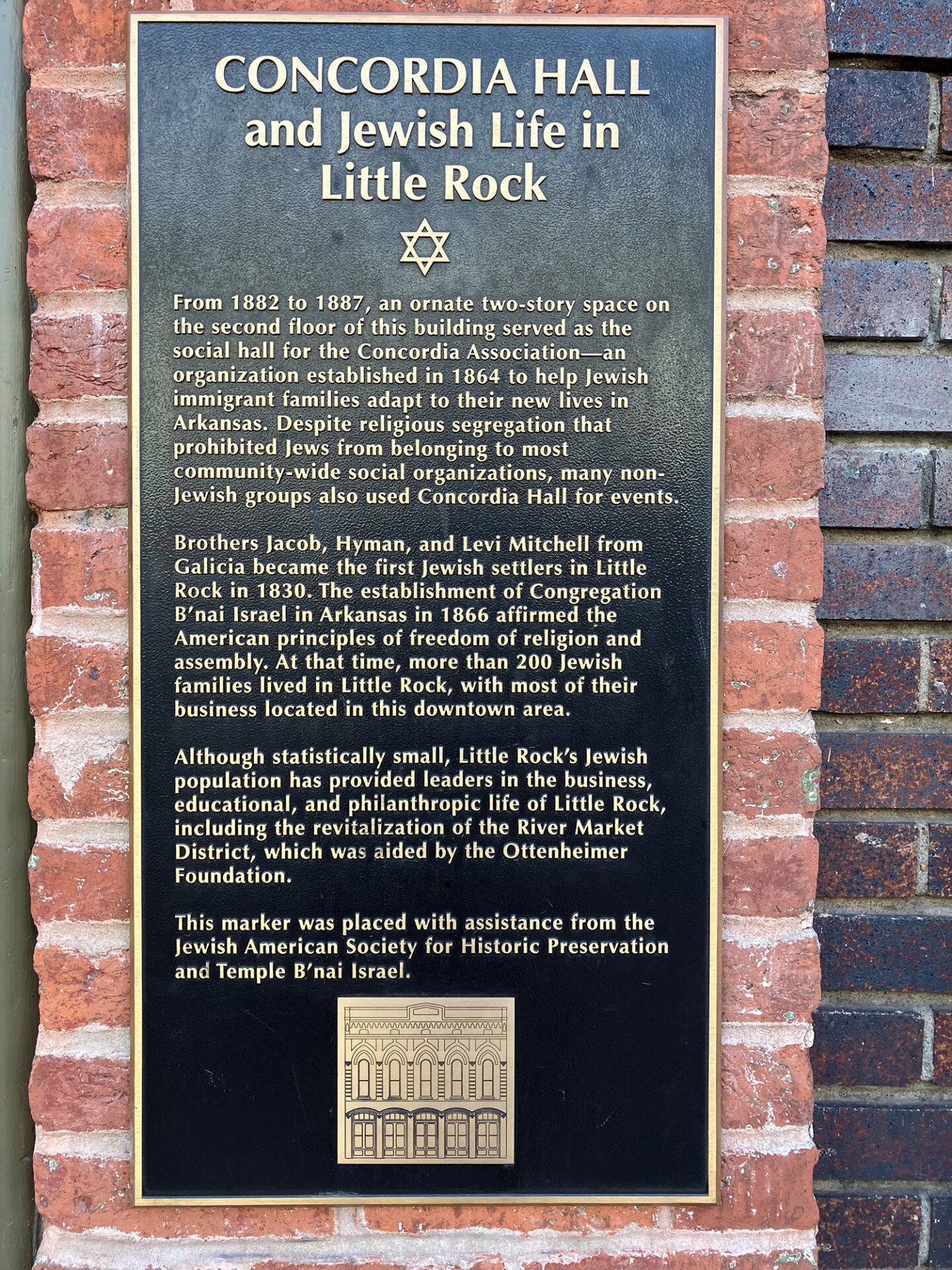Metal sign on brick wall "Concordia Hall and Jewish Life in Little Rock"