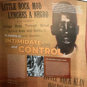 Wall display featuring African American lynching victim and informational text