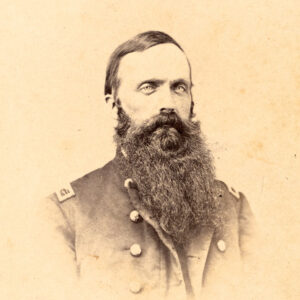 Bearded white man in military garb