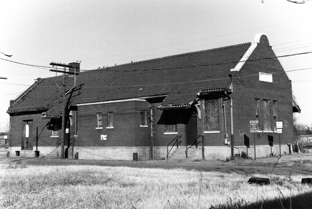 Brick depot building with boarded up windows