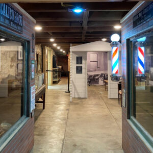 Barber display with a lit up striped pole