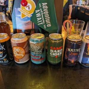 six cans of beer and cider with different designs
