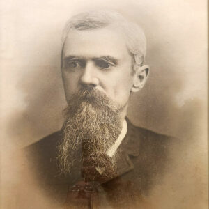 bearded white man in old fashioned suit